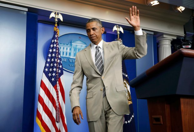 U.S. President Obama departs the White House Press Briefing Room after addressing reporters in Washington