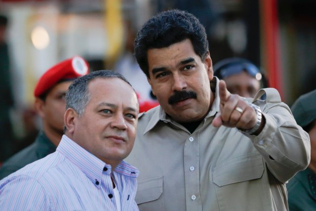 Venezuela's President Maduro talks to National Assembly President Cabello during a ceremony in Caracas