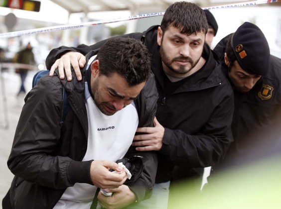 Family members of passengers feared killed in Germanwings plane crash react at Barcelona's El Prat airport