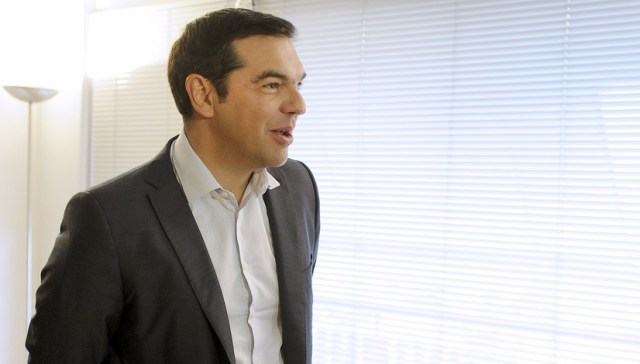 Leftist Syriza party leader and winner of the Greek general election Alexis Tsipras is seen before a meeting with leader of right-wing Independent Greeks party Panos Kammenos (not pictured), at his office at the party's headquarters in Athens, Greece, September 21, 2015. Greece's Independent Greeks party said on Sunday it would ally with election winners Syriza to form a coalition government. REUTERS/Michalis Karagiannis