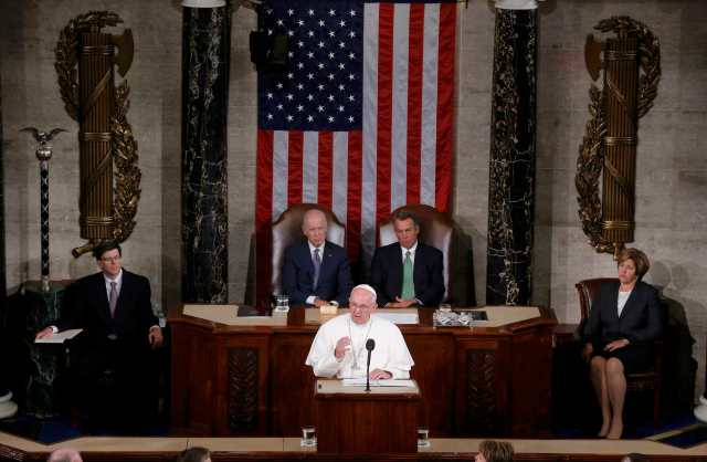 Pope Francis (C) addresses a joint meeting of the U.S. Congress as Vice President Joe Biden (L) and Speaker of the House John Boehner (R) look on in the House of Representatives Chamber on Capitol Hill in Washington September 24, 2015. REUTERS/Jim Bourg