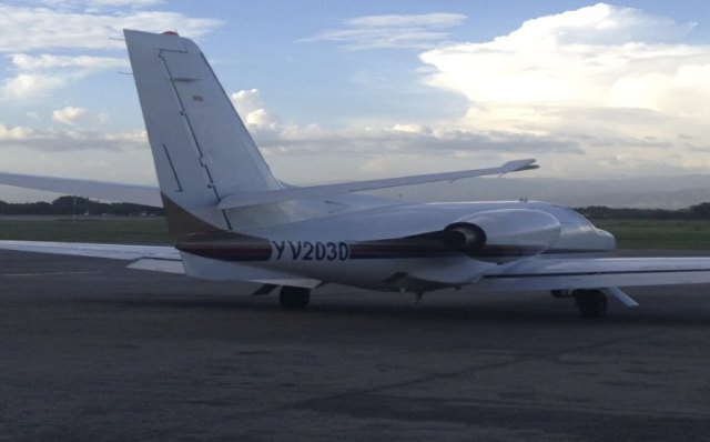 A small Cessna plane, model 500 Citation-I, which was used by two of Venezuelan President Nicolas Maduro's relatives Franqui Francisco Flores de Freitas and Efain Antonio Campo Flores, according to Haiti's National Police, is seen parked at the airport in Port-au-Prince in Haiti, in this undated photo distributed by Haiti's National Police on November 12, 2015. The two nephews of  Maduro's wife, Cilia Flores have been indicted in the U.S. for cocaine smuggling, according to court papers on Thursday, following an international sting that Venezuela cast as an "imperialist" attack.  REUTERS/Haiti National Police/Handout via Reuters  ATTENTION EDITORS - THIS PICTURE WAS PROVIDED BY A THIRD PARTY. REUTERS IS UNABLE TO INDEPENDENTLY VERIFY THE AUTHENTICITY, CONTENT, LOCATION OR DATE OF THIS IMAGE. FOR EDITORIAL USE ONLY. NOT FOR SALE FOR MARKETING OR ADVERTISING CAMPAIGNS. THIS PICTURE IS DISTRIBUTED EXACTLY AS RECEIVED BY REUTERS, AS A SERVICE TO CLIENTS.