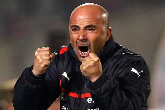 Chile's head coach Jorge Sampaoli celebrates a goal by his team during a 2014 World Cup qualifying soccer match against Bolivia in Santiago June 11, 2013.   REUTERS/Ivan Alvarado (CHILE - Tags: SPORT SOCCER)