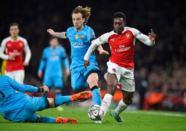 Football Soccer - Arsenal v FC Barcelona - UEFA Champions League Round of 16 First Leg - Emirates Stadium, London, England - 23/2/16 Arsenal's Danny Welbeck in action with Barcelona's Ivan Rakitic  Reuters / Dylan Martinez Livepic EDITORIAL USE ONLY.