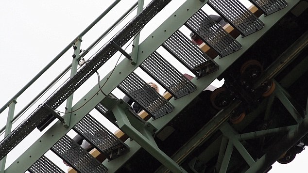 This is the moment passengers were evacuated from a Thorpe Park rollercoaster carriage yesterday (Sun) after it ground to a halt mid-ride. People were escorted from Colossus after staff spotted one rider putting their leg outside of the cart on CCTV at around 11am. The clip shows some guests being escorted down the stairs at the side of the track while others remain seated. Henry Moody, 14, who was visiting the park, in Chertsey, Surrey, with his family said the passengers were near the top of the 100ft ride