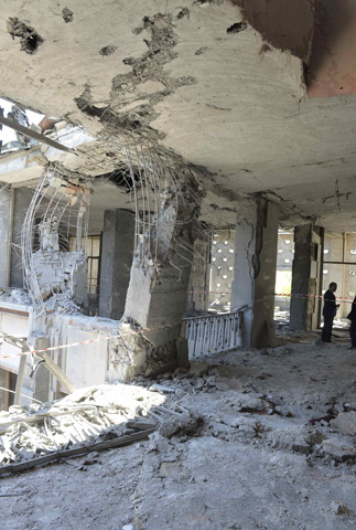 A man stands inside the destroyed parliament building in Ankara, Turkey, July 16, 2016. REUTERS/Stringer EDITORIAL USE ONLY. NO RESALES. NO ARCHIVES.