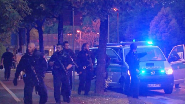 QUALITY REPEAT - A screen grab taken from video footage shows police officers near the Olympia shopping mall following a shooting rampage in Munich, Germany July 22, 2016. REUTERS/Reuters TV