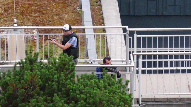 A screen grab taken from video footage shows plain clothes police officers at the scene of a shooting rampage at the Olympia shopping mall in Munich, Germany July 22, 2016. dedinac/Marc Mueller/ handout via REUTERS NO ARCHIVES. FOR EDITORIAL USE ONLY. NOT FOR SALE FOR MARKETING OR ADVERTISING CAMPAIGNS. THIS IMAGE HAS BEEN SUPPLIED BY A THIRD PARTY. IT IS DISTRIBUTED, EXACTLY AS RECEIVED BY REUTERS, AS A SERVICE TO CLIENTS.