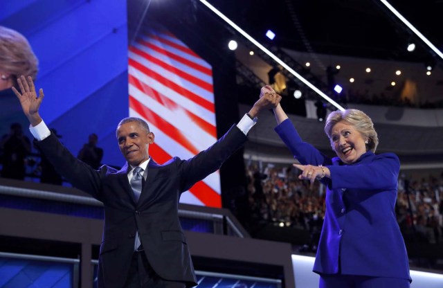 U.S. President Barack Obama and Democratic Nominee for President Hillary Clinton appear onstage together after Obama addressed the third night of the 2016 Democratic National Convention in Philadelphia, Pennsylvania, U.S., July 27, 2016. REUTERS/Jim Young