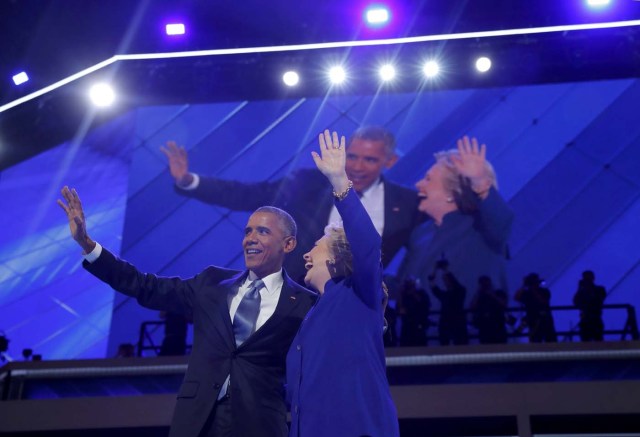 U.S. President Barack Obama and Democratic nominee for president Hillary Clinton appear onstage together after President Obama addressed the third night of the 2016 Democratic National Convention in Philadelphia, Pennsylvania, U.S., July 27, 2016. REUTERS/Jim Young
