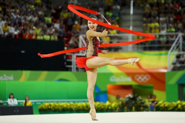 2016 Rio Olympics - Rhythmic Gymnastics - Preliminary - Individual All-Around Qualification - Rotation 3 - Rio Olympic Arena - Rio de Janeiro, Brazil - 19/08/2016. Son Yeon-Jae (KOR) of South Korea competes using the ribbon. REUTERS/Mike Blake FOR EDITORIAL USE ONLY. NOT FOR SALE FOR MARKETING OR ADVERTISING CAMPAIGNS.