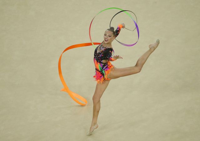 2016 Rio Olympics - Rhythmic Gymnastics - Preliminary - Individual All-Around Qualification - Rotation 4 - Rio Olympic Arena - Rio de Janeiro, Brazil - 19/08/2016. Melitina Staniouta (BLR) of Belarus competes using the ribbons. REUTERS/Ruben Sprich  FOR EDITORIAL USE ONLY. NOT FOR SALE FOR MARKETING OR ADVERTISING CAMPAIGNS.