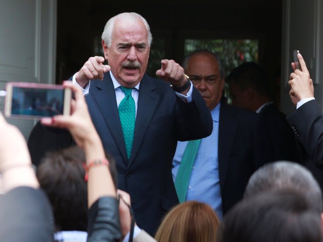 Colombian former President Andres Pastrana talks with journalists after a meeting with Colombia's President Juan Manuel Santos at Narino Palace in Bogota, Colombia