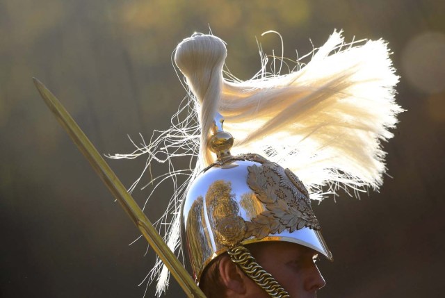 Members of the Household Cavalry ride out amongst autumn foliage early morning in Hyde Park in London in Britain, November 2, 2016. REUTERS/Toby Melville