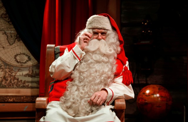 Santa Claus waits for visitors at Santa Claus' Village on the Arctic Circle near Rovaniemi, Finland December 15, 2016. REUTERS/Pawel Kopczynski SEARCH "KOPCZYNSKI SANTA" FOR THIS STORY. SEARCH "THE WIDER IMAGE" FOR ALL STORIES