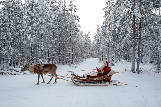 Santa Claus rides in his sleigh as he prepares for Christmas in the Arctic Circle near Rovaniemi, Finland December 15, 2016. REUTERS/Pawel Kopczynski SEARCH "KOPCZYNSKI SANTA" FOR THIS STORY. SEARCH "THE WIDER IMAGE" FOR ALL STORIES