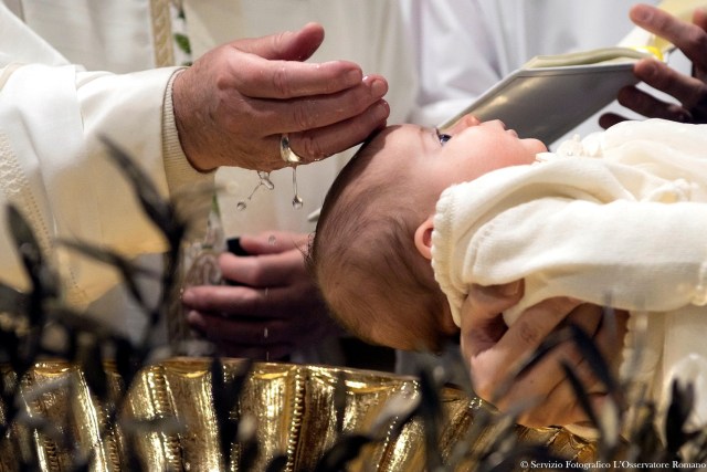 Pope Francis baptizes a baby during a ceremony in the Sistine Chapel at the Vatican January 8, 2017. Osservatore Romano/Handout via Reuters ATTENTION EDITORS - THIS IMAGE WAS PROVIDED BY A THIRD PARTY. EDITORIAL USE ONLY. NO RESALES. NO ARCHIVE.