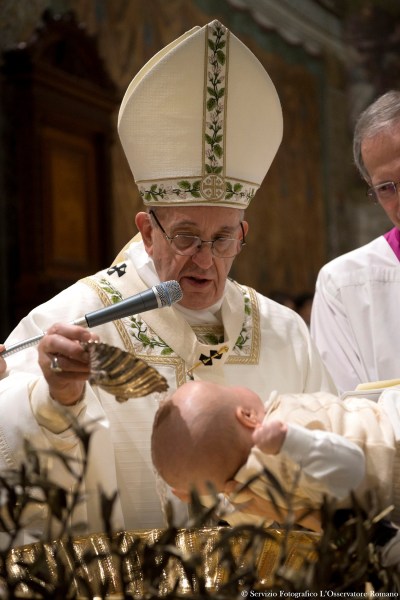 Pope Francis baptizes a baby during a ceremony in the Sistine Chapel at the Vatican January 8, 2017. Osservatore Romano/Handout via Reuters ATTENTION EDITORS - THIS IMAGE WAS PROVIDED BY A THIRD PARTY. EDITORIAL USE ONLY. NO RESALES. NO ARCHIVE.