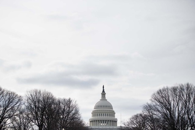 A view of the US Capitol building before tomorrow's Inauguration on Capitol Hill January 19, 2017 in Washington, DC. With one day to go before he takes the oath of office as the 45th US president, Donald Trump arrives in Washington Thursday determined to transform US politics over the next four years. / AFP PHOTO / Brendan Smialowski