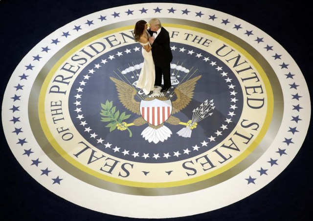 President Donald Trump dances with first lady Melania Trump, at The Salute To Our Armed Services Inaugural Ball in Washington, Friday, Jan. 20, 2017. (AP Photo/Evan Vucci)