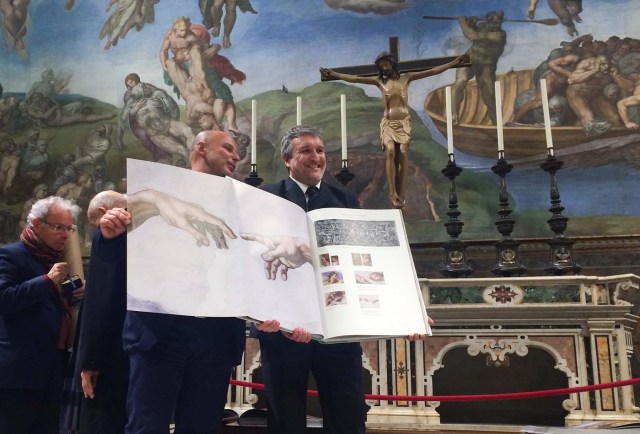 A 1:1 scale photographic book depicting Sistine Chapel is seen during a news conference in the Sistine Chapel, the Vatican February 24, 2017. Picture taken February 24, 2017. REUTERS/Philip Pullella FOR EDITORIAL USE ONLY. NO RESALES. NO ARCHIVES