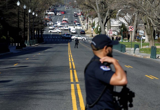 Capitol Hill police block traffic after a car whose driver struck a Capitol Police cruiser and then tried to run over officers, near the U.S. Capitol in Washington, U.S., March 29, 2017. REUTERS/Joshua Roberts