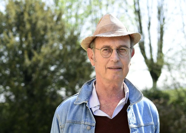 TO GO WITH AFP STORY BY CELINE CORNU Gianantonio Locatelli, founder of the Shit Museum (Museum of Poop), poses on march 28, 2017 at the Castelbosco castle of Gragnano Trebbiense, which host the Museo della Merda. The idea of the Shit Museum founded in 2015 came from a farm which makes milk for Grana Padano cheese with 3,500 cows producing around 50,000 litres of milk and 150,000 kilos of dung to be recycled. Under Locatelli?s management, this quantity of feces started to be transformed into a futuristic ecological, productive and cultural project. Using innovative systems, electrical energy started to be produced from the manure but also green fertilizer and objects made from "Merdacotta".  / AFP PHOTO / MIGUEL MEDINA