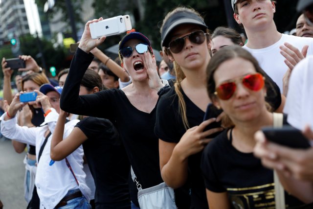 Opposition supporters attend a tribute for Juan Pablo Pernalete, who died after being hit by a tear gas shot during a protest against Venezuelan President Nicolas Maduro, in Caracas, Venezuela April 27, 2017. REUTERS/Carlos Garcia Rawlins