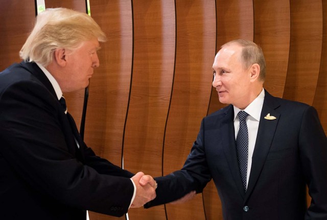 U.S. President Donald Trump and Russia's President Vladimir Putin shake hands during the G20 Summit in Hamburg, Germany in this still image taken from video, July 7, 2017. REUTERS/Steffen Kugler/Courtesy of Bundesregierung/Handout via REUTERS ATTENTION EDITORS - THIS PICTURE WAS PROVIDED BY A THIRD PARTY. NO RESALES. NO ARCHIVE      TPX IMAGES OF THE DAY