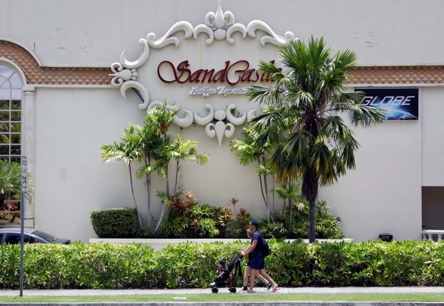 Tourists stroll in the Tumon tourist district on the island of Guam, a U.S. Pacific Territory, August 10, 2017. REUTERS/Erik De Castro