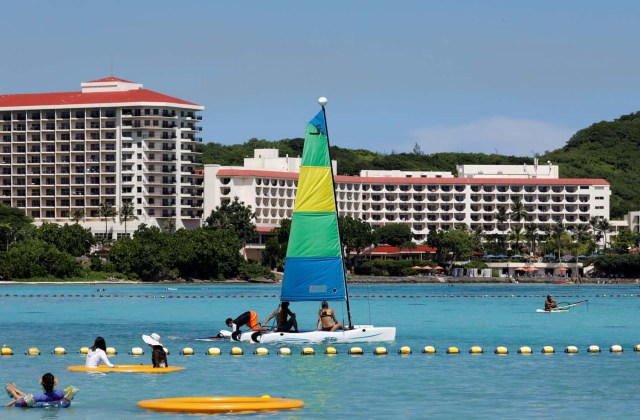 Tourists are pictured on the waters off Tumon beach near Hilton Hotel on the island of Guam, a U.S. Pacific Territory, August 11, 2017. REUTERS/Erik De Castro