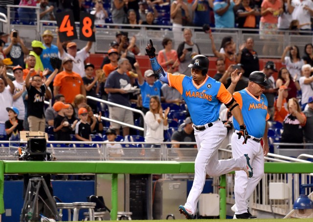 Aug 25, 2017; Miami, FL, USA; Miami Marlins right fielder Giancarlo Stanton (27) rounds the bases after hitting a two run home in the first inning against the San Diego Padres at Marlins Park. Mandatory Credit: Steve Mitchell-USA TODAY Sports