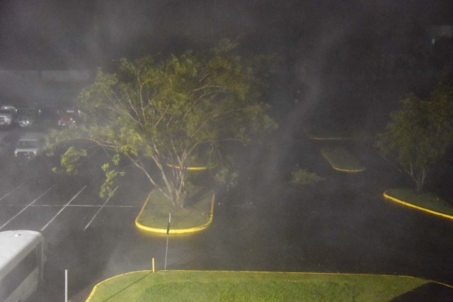 This view shows the rain from the passage of the Hurricane Maria from Roberto Clemente Coliseum where residents have sought shelter in San Juan, Puerto Rico, early on September 20, 2017. Hurricane Maria closed in on the Virgin Islands and Puerto Rico on September 20 as forecasters warned of a "potentially catastrophic" storm that has already killed at least two people in the Caribbean. / AFP PHOTO / HECTOR RETAMAL