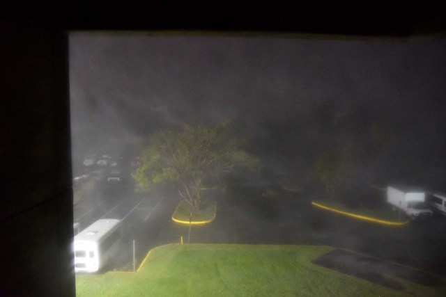 This view shows the rain from the passage of the Hurricane Maria from Roberto Clemente Coliseum where residents have sought shelter in San Juan, Puerto Rico, early on September 20, 2017. Hurricane Maria closed in on the Virgin Islands and Puerto Rico on September 20 as forecasters warned of a "potentially catastrophic" storm that has already killed at least two people in the Caribbean. / AFP PHOTO / HECTOR RETAMAL