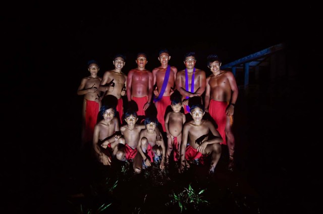 A group of Waiapi youngsters pose for a picture at the Manilha village in Waiapi indigenous reserve in Amapa state in Brazil on October 14, 2017.  Tribal chieftain Tzako Waiapi perfectly remembers the day almost half a century ago when his hunting party stumbled across a group of white adventurers in the Amazon rainforest. Within months, nearly everyone in his entire tribe had died from disease.  / AFP PHOTO / Apu Gomes / TO GO WITH AFP STORY "When the Waipai tribe almost died out" by Sebastian Smith