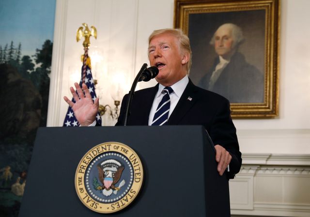 U.S. President Donald Trump makes a statement on the mass shooting in Las Vegas in front of a portrait of President George Washington in the Diplomatic Room at the White House in Washington, U.S., October 2, 2017. REUTERS/Kevin Lamarque