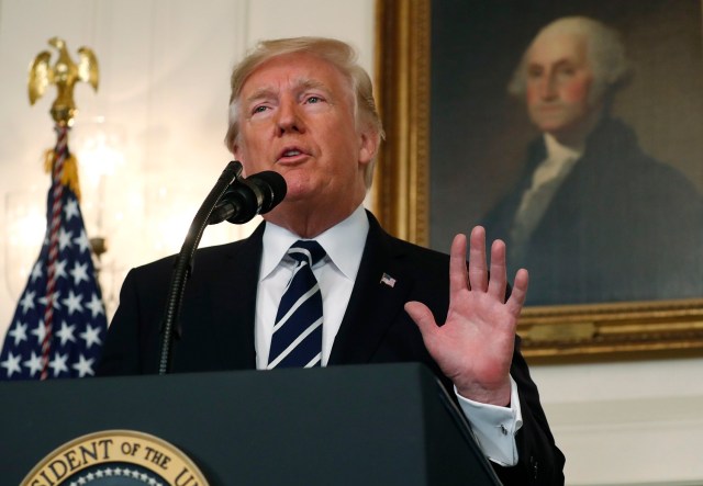 U.S. President Donald Trump makes a statement on the mass shooting in Las Vegas in front of a portrait of President George Washington in the Diplomatic Room at the White House in Washington, U.S., October 2, 2017. REUTERS/Kevin Lamarque