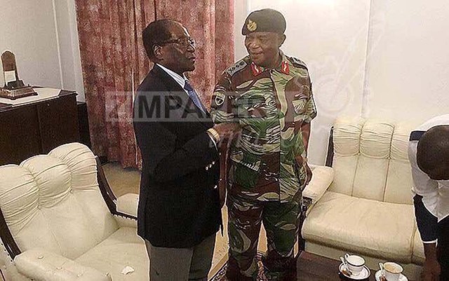 President Robert Mugabe poses with General Constantino Chiwenga at State House in Harare, Zimbabwe, November 16, 2017. ZIMPAPERS/Joseph Nyadzayo/Handout via REUTERS ATTENTION EDITORS - THIS IMAGE HAS BEEN SUPPLIED BY A THIRD PARTY. NO RESALES. NO ARCHIVES. ZIMBABWE OUT