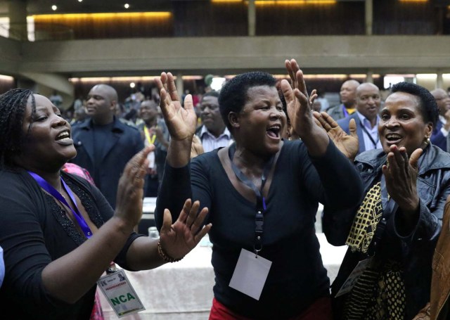 Delegates celebrate after Zimbabwean President Robert Mugabe was dismissed as party leader at an extraordinary meeting of the ruling ZANU-PF's central committee in Harare, Zimbabwe November 19, 2017. REUTERS/Philimon Bulawayo