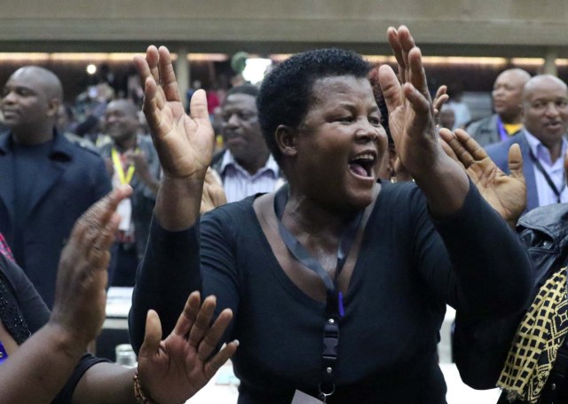 Delegates celebrate after Zimbabwean President Robert Mugabe was dismissed as party leader at an extraordinary meeting of the ruling ZANU-PF's central committee in Harare, Zimbabwe November 19, 2017. REUTERS/Philimon Bulawayo