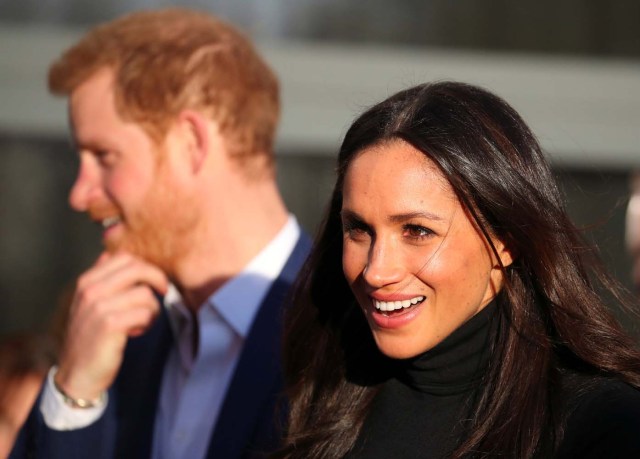 Britain's Prince Harry and his fiancee Meghan Markle leave after visiting a school in Nottingham, December 1, 2017. REUTERS/Hannah McKay