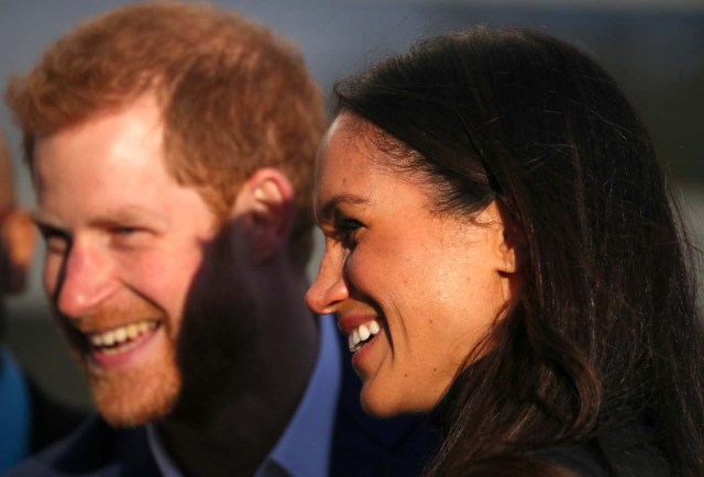 Britain's Prince Harry and his fiancee Meghan Markle leave after visiting a school in Nottingham, December 1, 2017. REUTERS/Hannah McKay