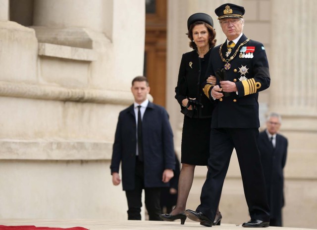 King Carl Gustaf of Sweden and his wife, Sweden's Queen Silvia, arrive at the Patriarchal Cathedral as they attend a funeral ceremony for late Romanian King Michael in Bucharest, Romania, December 16, 2017. REUTERS/Stoyan Nenov