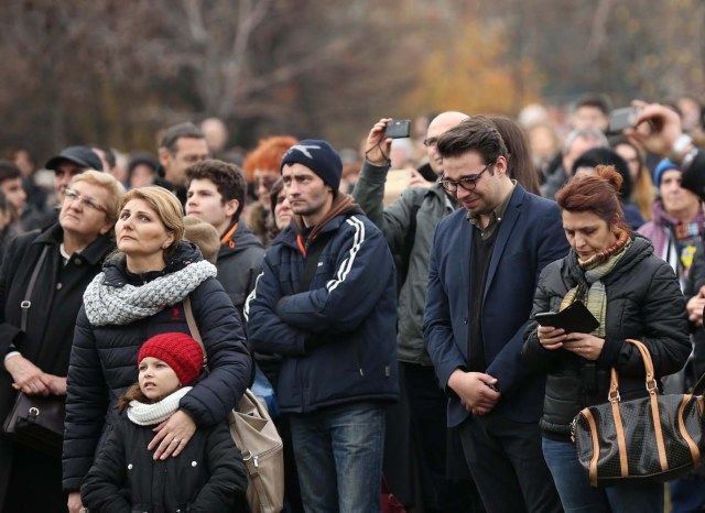 People stand during a funeral ceremony for late Romanian King Michael in Bucharest, Romania, December 16, 2017. REUTERS/Stoyan Nenov