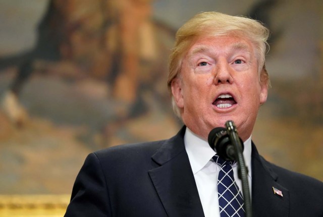 U.S. President Donald Trump speaks before signing a proclamation to honor Martin Luther King Jr. day in the Roosevelt Room of the White House in Washington, U.S., January 12, 2018.   REUTERS/Joshua Roberts