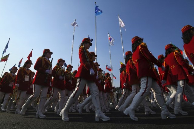 North Korean cheerleaders arrive to participate in a welcoming ceremony for North Korea's Olympic team at the Olympic Village in Gangneung on February 8, 2018, ahead of the Pyeongchang 2018 Winter Olympic Games. / AFP PHOTO / JUNG Yeon-Je