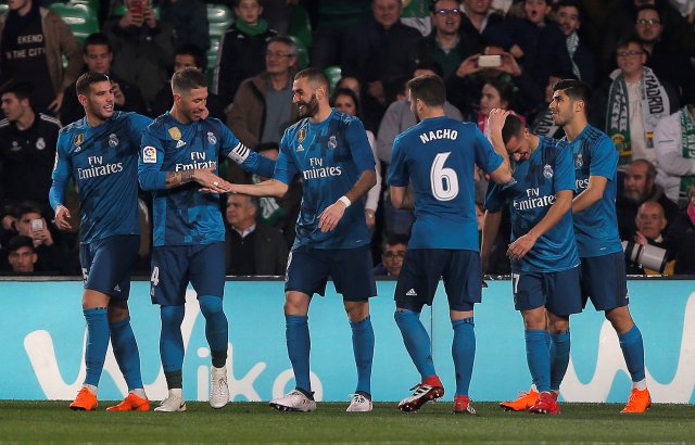 Soccer Football - La Liga Santander - Real Betis vs Real Madrid - Estadio Benito Villamarin, Seville, Spain - February 18, 2018 Real Madrid’s Karim Benzema celebrates scoring their fifth goal with Sergio Ramos and teammates REUTERS/Jon Nazca