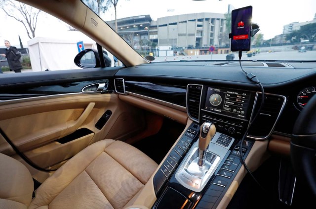 A Huawei Mate 10 Pro mobile is used to control a driverless car during the Mobile World Congress in Barcelona, Spain February 26, 2018. REUTERS/Yves Herman