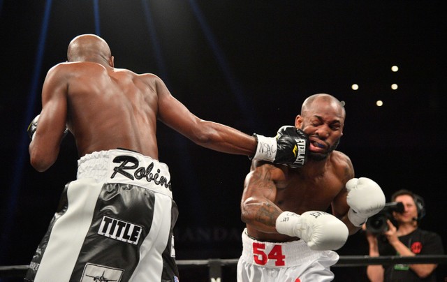 Feb 17, 2018; Las Vegas, NV, USA; Yordenis Ugas (white trunks) and Ray Robinson (black trunks) box during a boxing match at Mandalay Bay Events Center. Mandatory Credit: Joe Camporeale-USA TODAY Sports