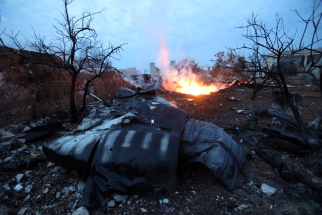 A picture taken on February 3, 2018, shows smoke billowing from the site of a downed Sukhoi-25 fighter jet near the Syrian city of Saraqib, southwest of Aleppo. Rebel fighters shot down a Russian plane over Syria's northwest Idlib province and captured its pilot, the Syrian Observatory for Human Rights said. / AFP PHOTO / OMAR HAJ KADOUR